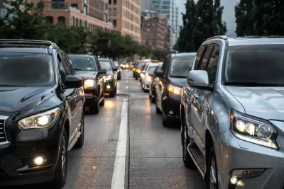 Close-up of black and gray SUVs in New York City traffic