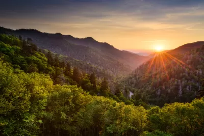 View of wooded mountains with sunset in background in the Smoky Mountains.