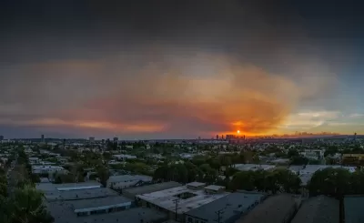 Smoky sky overlooking Los Angeles skyline during 2025 wildfires.