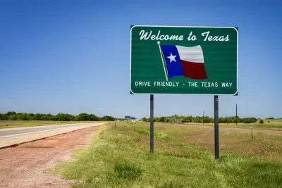 "Welcome to Texas" road sign with Texas flag and "Drive Friendly - the Texas way" slogan