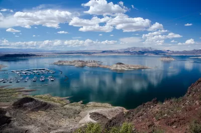 Lake Mead on the Colorado River with boats in a marina and clear low water line.