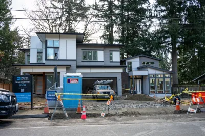 New modern home in grays with ADU and porta-potty out front being built in Kirkland, Washington.