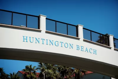 'Huntington Beach' sign on pedestrian bridge over Pacific Coast Highway.