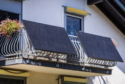 Solar panels installed on wrought iron balcony in Germany.