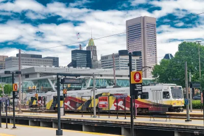 Camden Station train platform with white and red tram in Baltimore, Maryland.