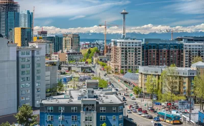 View of downtown Seattle with Space Needle and mountains in background