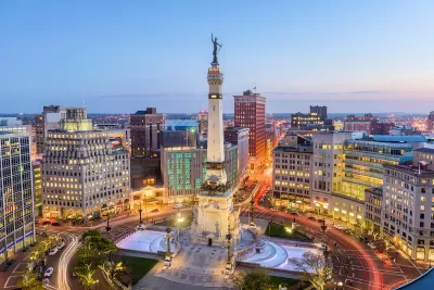 Aerial view of statue on top of tall obelisk in downtown Indianapolis, Indiana.