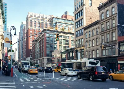 Traffic and old buildings in Manhattan, New York City.