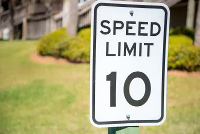 Close-up of 10 mph speed limit sign.