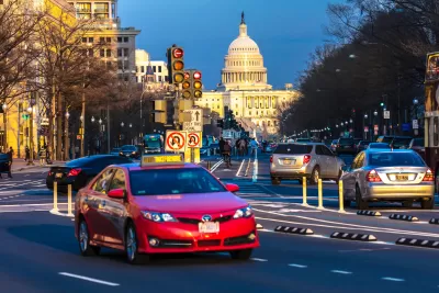 Traffic on Pennsylvania Avenue with U.S. Capitol dome in background