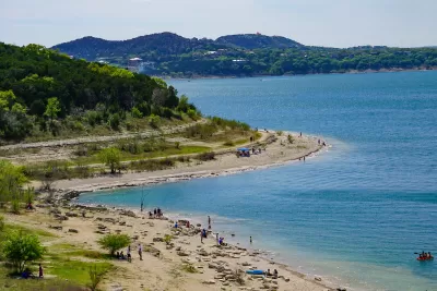 Aerial view of blue Canyon Lake reservoir beach in Texas on sunny day.
