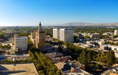 Aerial view of San Jose, California with mountains in background.