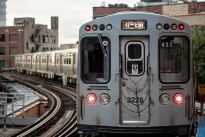 Silver train on elevated rail in Chicago, Illinois.