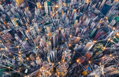 Aerial view of dense urban center with lines indicating smart city concept.