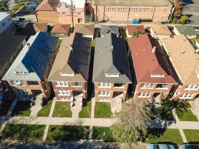 Aerial view of narrow two-story Chicago townhomes.
