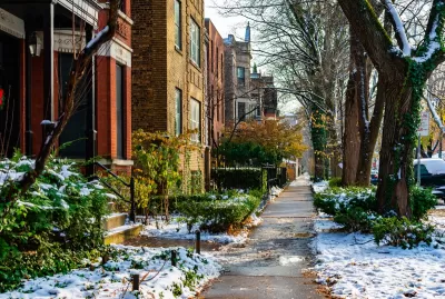 Chicago sidewalk with brick homes in winter.