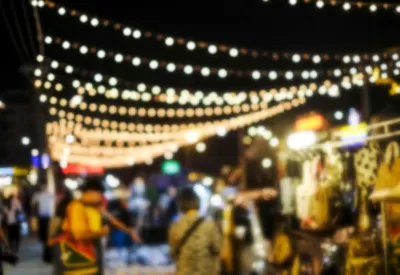 Blurred image of people shopping at night market