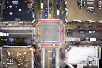 Bird's eye view of rainbow-colored crosswalk in the Castro district in San Francisco, California.