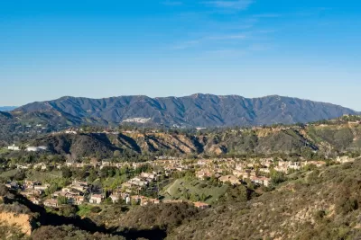 Homes in Altadena, California with mountains in background on a sunny day.