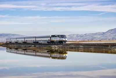 Amtrak train passing over bridge on Alviso Marsh near San Jose, California.
