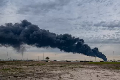 Black plume of smoke rising from petrochemical plant fire in Houston, Texas