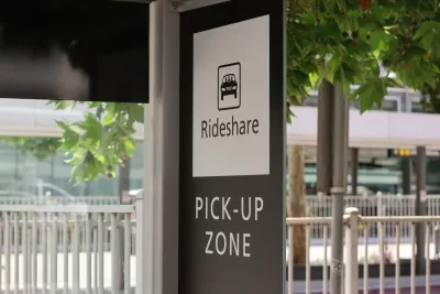 Black and white Rideshare Pick-Up Zone sign