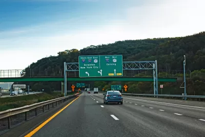 Freeway in New York State with signs for New York City and Scranton.