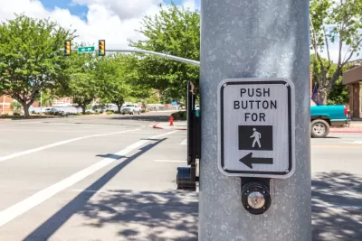 CLose-up of pedestrian call button on pole at intersection