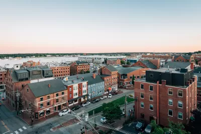 Aerial view of mid-rise brick buildings in Portland, Maine on waterfront.