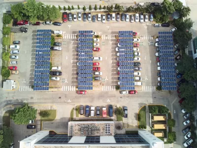 Bird's eye view of parking lot with solar panel canopies