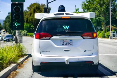 View from rear of white Waymo autonomous taxi van in Mountain View, California