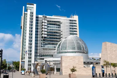 San Jose, California city hall with glass dome in front of modern multistory building.