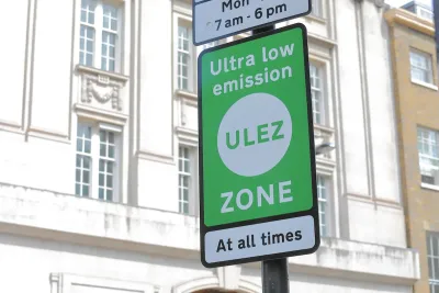 Close-up of green ULEZ sign in London, UK.