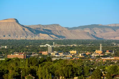 View of downtown Grand Junction, Colorado with mesas in background.