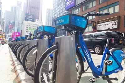 Blue Citi Bike bike share bikes parked at a station near Times Square in New York City