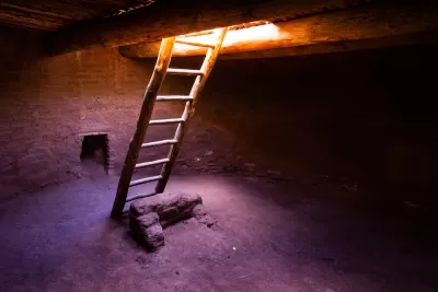 Ladder going down into kiva ruin in New Mexico.