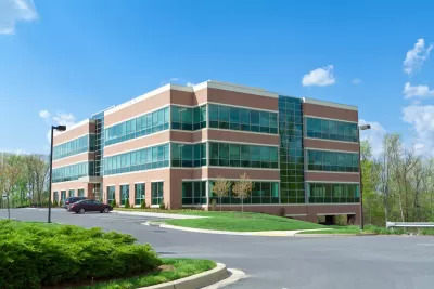 Three-story modern suburban office building.