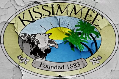 Kissimmee, Florida "Founded 1883" crest painted on cracked wall.