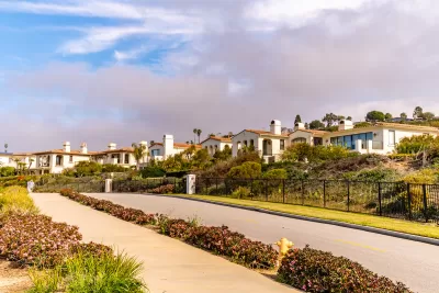 Row of white Spanish Revival-style homes in Torrance, California.