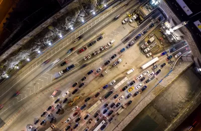 Bird's eye view of traffic entering Lincoln Tunnel in Weehawken, New Jersey heading into Manhattan, New York City.