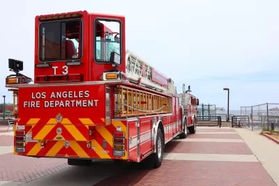 Red Los Angeles Fire Department fire truck parked on pier in San Pedro, California at Port of Los Angeles.