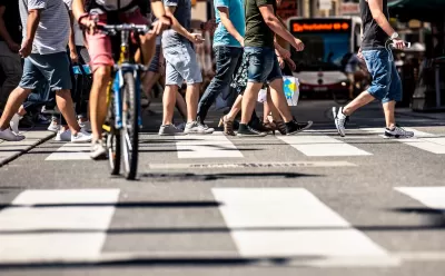Low close-up of busy city crosswalk in Vienna, Austria.