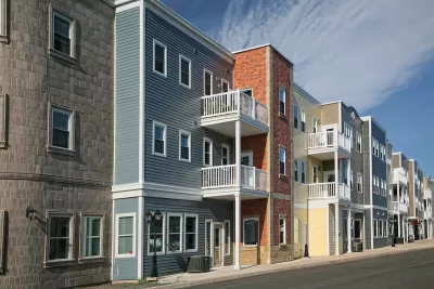 Colorful three-story multifamily housing.