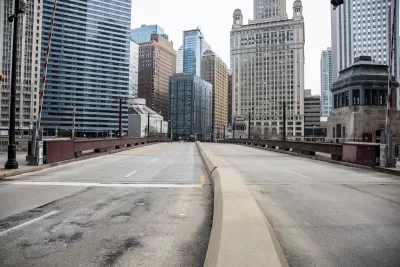 Empty street and high-rise buildings in downtown Chicago, Illinois during COvid-19 pandemic.