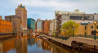 View of river and commercial buildings in downtown Milwaukee, Wisconsin.