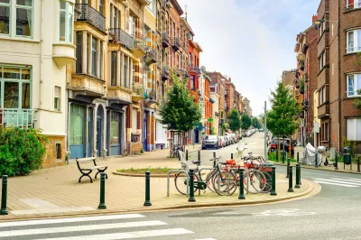 Streetscape in old neighborhood of Brussels, Belgium with bikes parked in bulb-out.