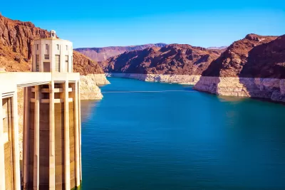 View of Colorado River from top of Hoover Dam with concrete column on left