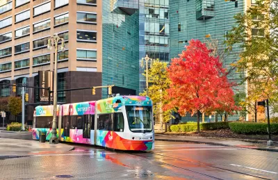 Colorful streetcar on street in downtown Detroit, Michigan.