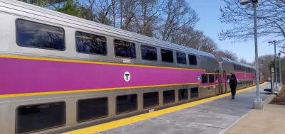 Silver commuter train with purple stripe in Boston, Massachusetts