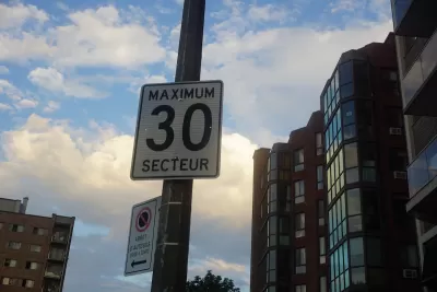 Close-up of "Maximum 30 Secteur" speed limit sign on pot in Quebec, Canada.